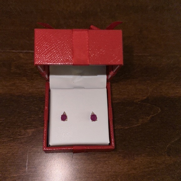 R.H. Macy & Co. Ruby 7/8 ct. t.w. Diamond Accent Stud Earrings 14k Yellow Gold - Picture 2 of 6